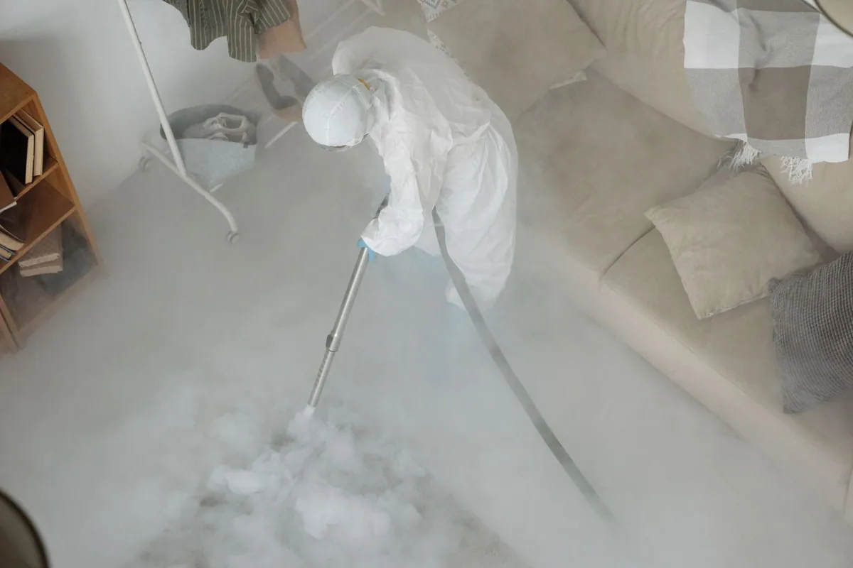 Biohazard cleanup technician in protective equipment, Hazard, KY